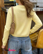 Cárdigan de punto amarillo